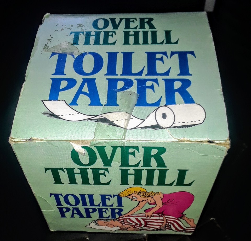 Sealed 'Over The Hill' novelty toilet paper from 1987 — a factory-fresh, time-capsule gag gift that's funnier *because* it's genuinely vintage and still unopened.