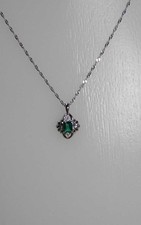 Platinum emerald and diamond pendant necklace E0.23ct. D0.02ct.