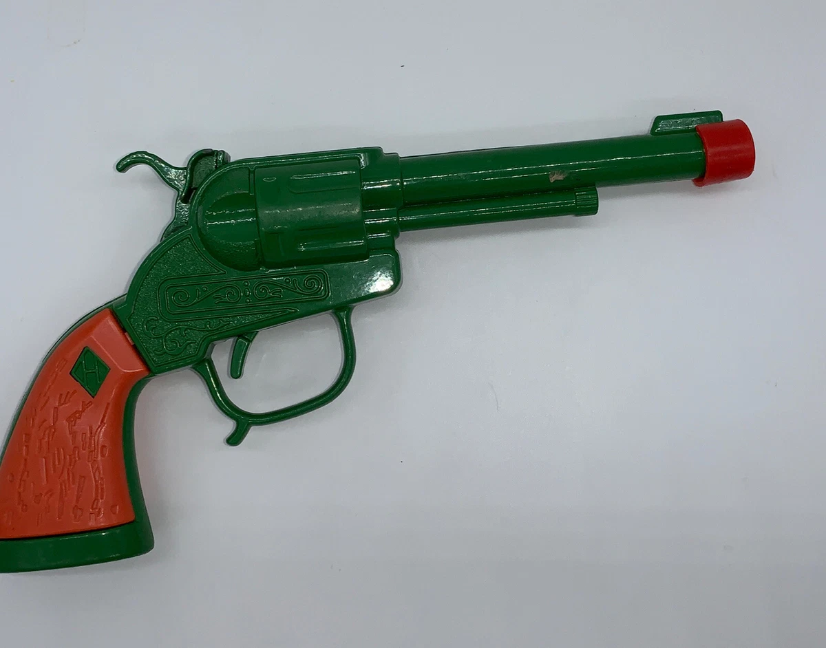 Green and orange toy gun top