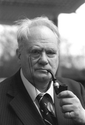 Astronomer Patrick Moore poses a telescope shaped pipe after being- Old Photo