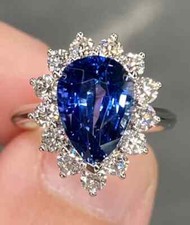 Impressive Clear Blue Pear Cut Sapphire  White Cubic Zirconia Halo Style Ring