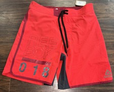 Reebok Dolphin Styled Logo Board Shorts, Red Medium