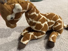 FAO schwarz giraffe plush stuffed animal laying down 12"