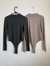 Two Ribbed High Cut Long Sleeve Bodysuits In Green And Tan