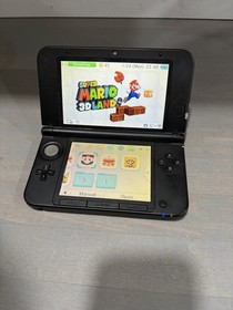 Nintendo 3DS XL Blue/Black with charger, SD card 8 games, tested works good.