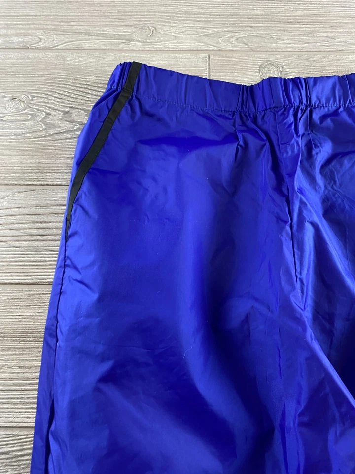 SIERRA DESIGNS, PANTALÓN CORTAVIENTOS LLUVIA MUJER S NYLON MORADO, CINTURA AJUSTABLE Foto 2 de 4