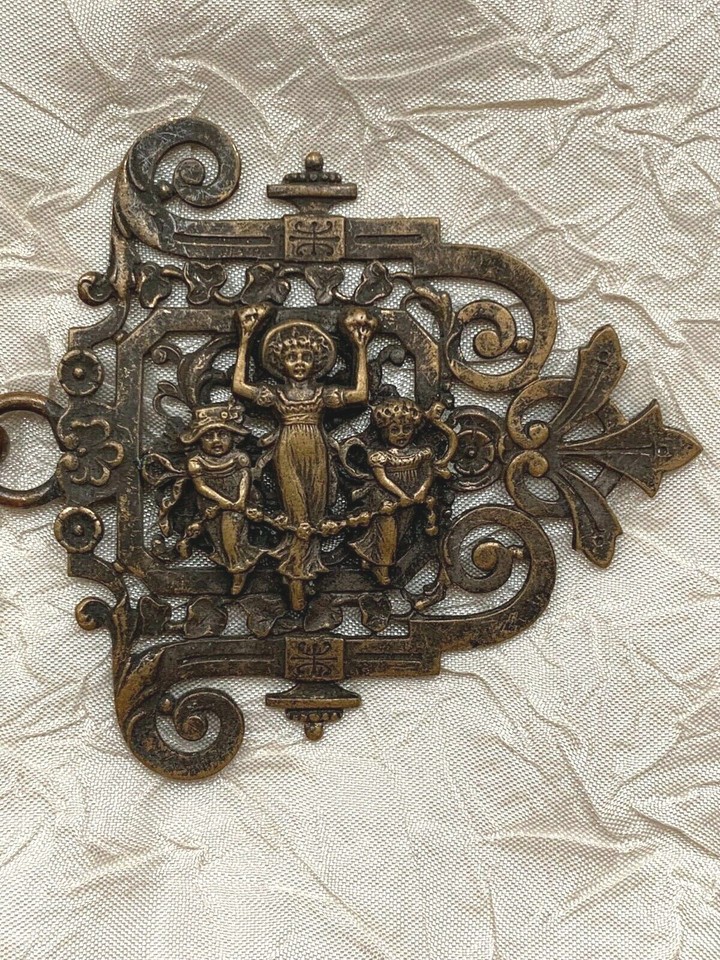 Antique Brass Buckle with three girls holding a rope covered with