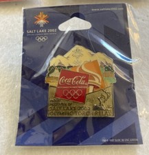 TORCIA COLA RELÈ CITTÀ LAGO SALATO 2002 SPILLA OLIMPICA - 2026 MILANO-CORTINA COMMERCIANTE