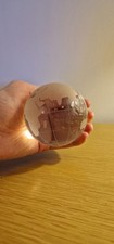 collectible glass or crystal world globe paperweight etched map of continents.