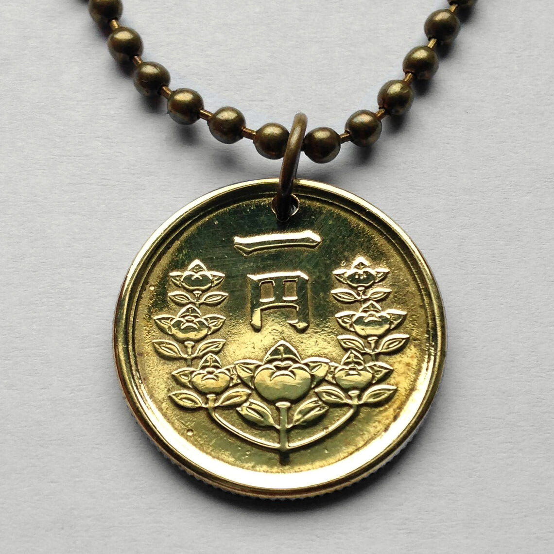けちょぶー 1949 Japan 1 Yen coin pendant Japanese orange blossom flower Tokyo