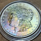 1883 - O Morgan Silver Dollar Monster Rainbow Toned Obverse BU Coin