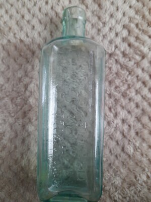 Vintage Lincoln World berühmte Blutmischung grün getönte Glasflasche
