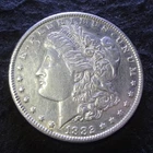 1882-CC Morgan Silver Dollar - Solid AU details from the Carson City Mint