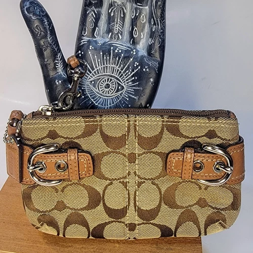 Bracciale Coach Signature marrone con doppie fibbie