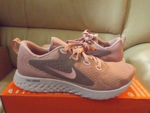 nike legend react rust pink