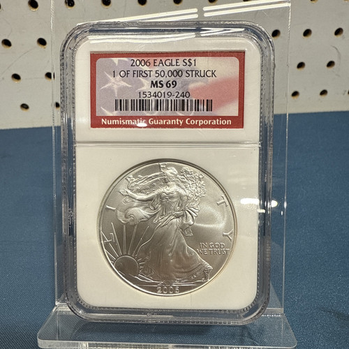 2006 $1 NGC MS69. 1 of first 50,000 struck. Desirable red label.