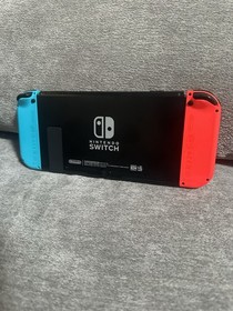 Nintendo Switch with Neon Blue and Neon Red Joy-Con + Mario Case And Accessories