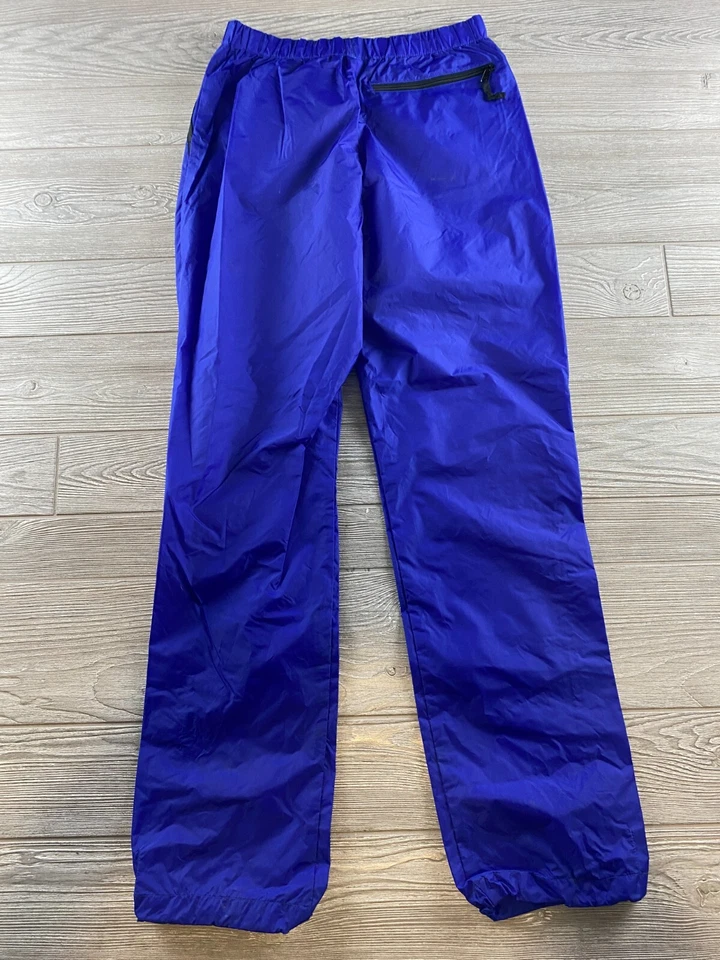 SIERRA DESIGNS, PANTALÓN CORTAVIENTOS LLUVIA MUJER S NYLON MORADO, CINTURA AJUSTABLE Foto 3 de 4