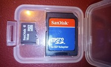 SanDisk 16GB Micro SD card w/adapter in plastic carrying case