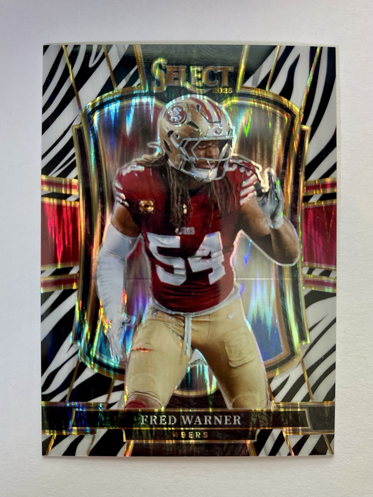 2025 Panini Select Fred Warner Premier Level Zebra Prizm Shock #118 49ers