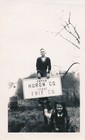vintage snapshot photo: Roadside Huron Erie Ohio County Road Sign w/ Boy & Girl — photo 1