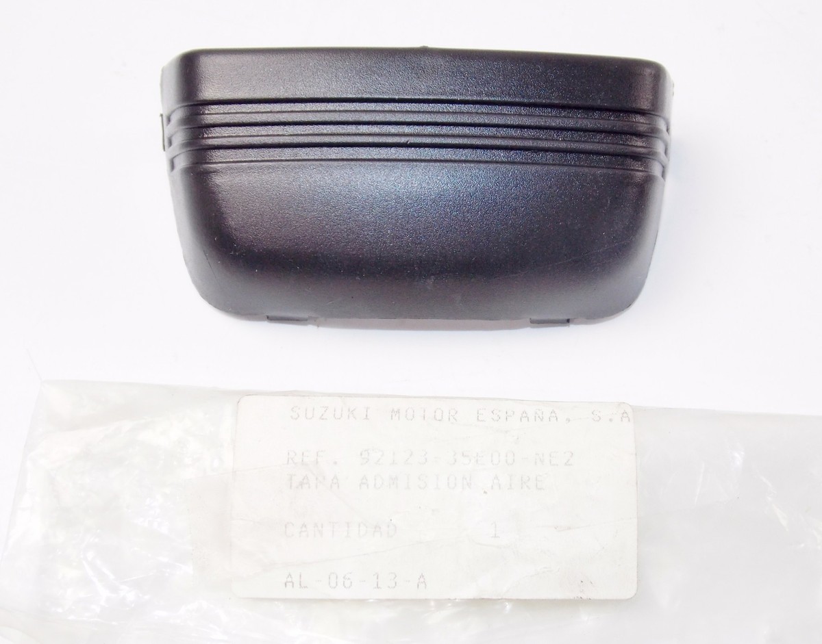 NOS OEM SUZUKI 2000-2006 AY50/V/W/X/Y AIR INTAKE COVER BLACK 92123