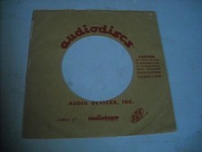 45 COMPANY RECORD SLEEVES. LOT OF ONE, GLOSSY AUDIO-DISCS. RED REVERSE
