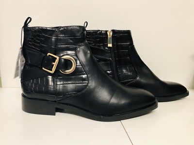 black flat boots with buckles