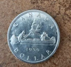 1959 uncirculated Canadian 80% silver dollar