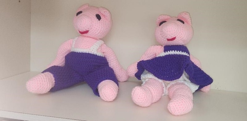Handmade crochet pink and purple pair of stuffed pigs