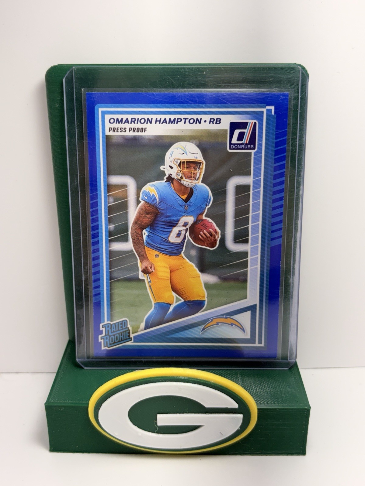 2025 Panini Donruss - Rated Rookie Omarion Hampton #303 Press Proof Blue (RC)