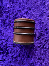 1970s brown finish round vintage doorstop