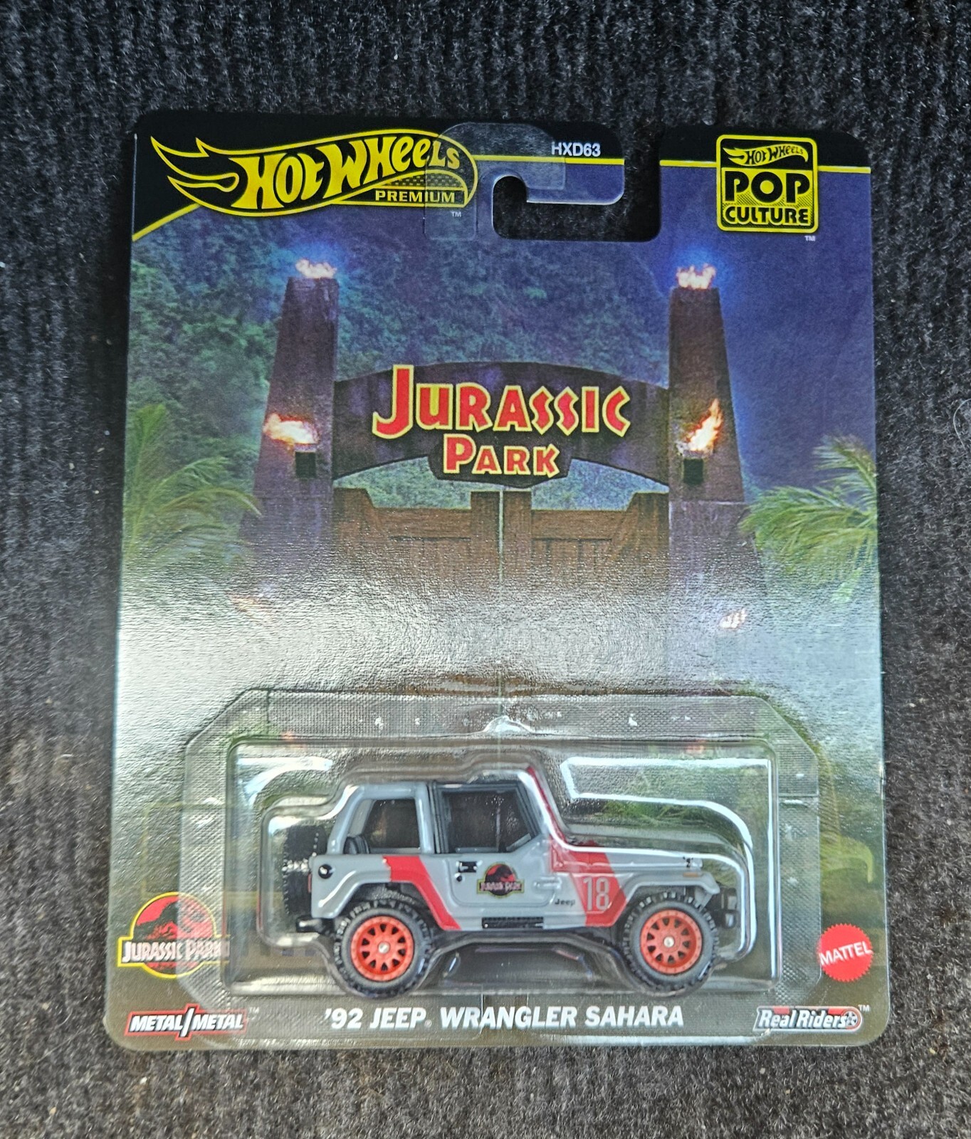 Hot Wheels Pop Culture Jurassic Park '92 Jeep Wrangler Sahara JBL59 - Scala 1:64