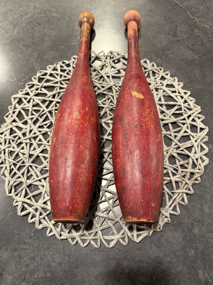 A pair of antique wooden Indian clubs used for exercise and juggling ...