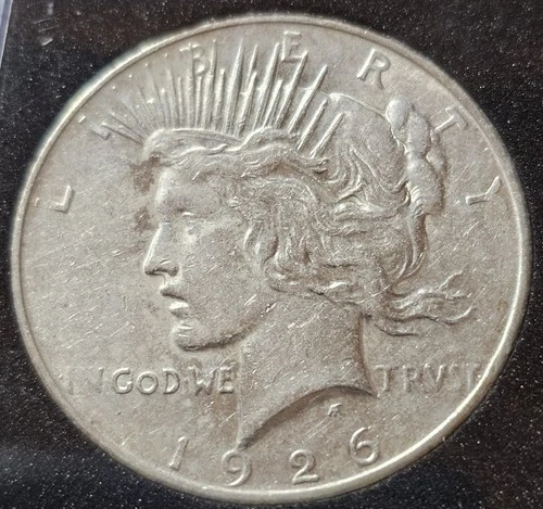 A 1926-D Peace Dollar 90% Silver $1 Dollar.  Nice High Grade BU