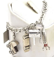 Vintage Sterling Silver 9 different flat & 3 Dimensional Charms ladies Bracelet