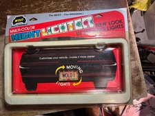 VINTAGE! WOLO NIGHT LIGHTER LF-1, MOVING LIGHTS LICENSE PLATE FRAME 1987 NOS