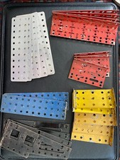 Lot of 50 vintage red, blue, yellow, black and silver Erector base plates