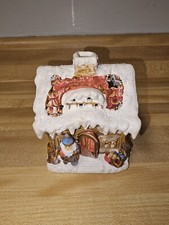 Christmas Decoration House With Santa And Snow On Top