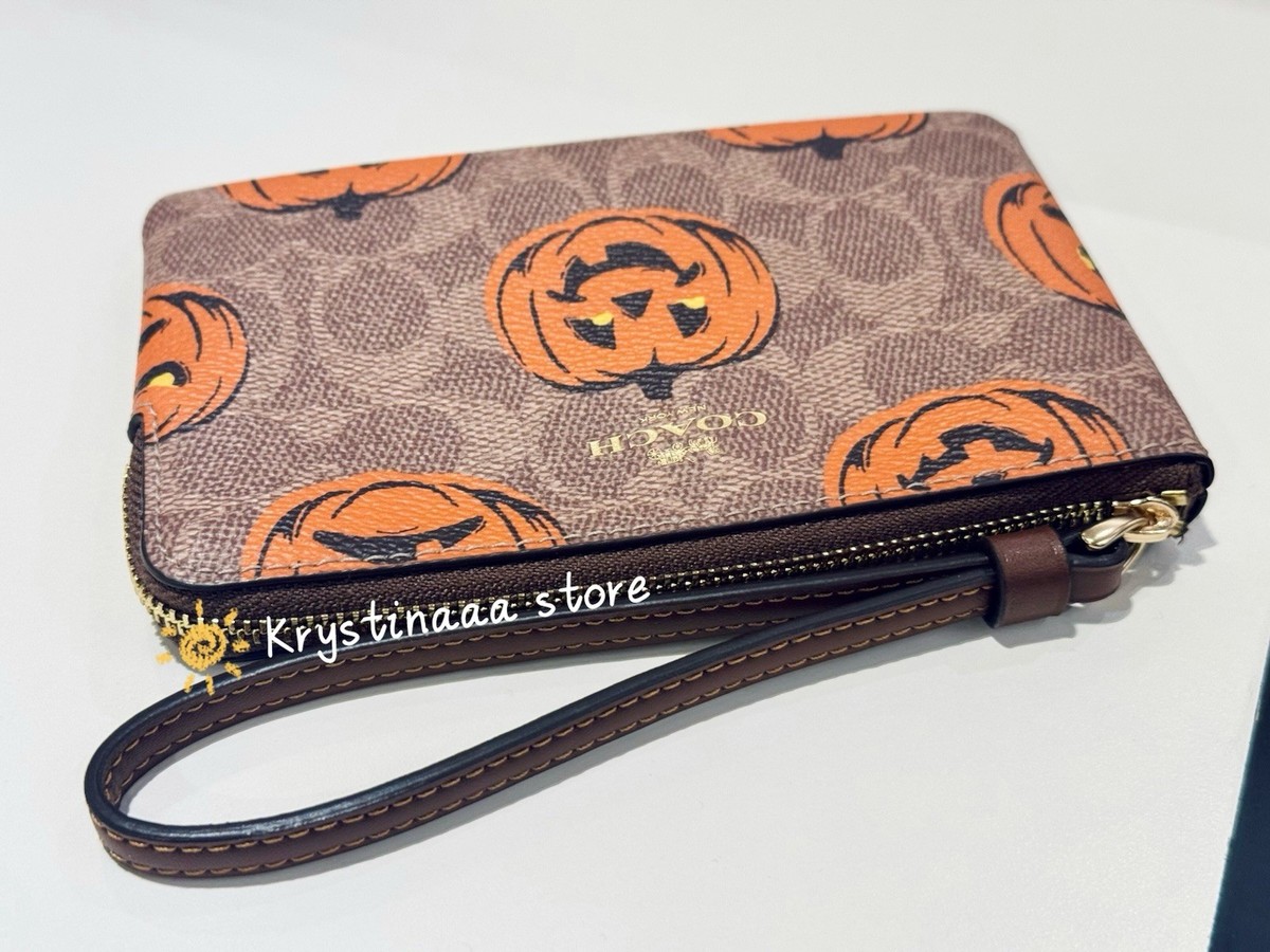 Coach Corner Zip Wristlet in Signature Canvas With Pumpkin Print