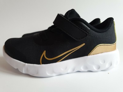 nike gold and black trainers