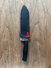 Gently used Faberware chefs knife with self-s...