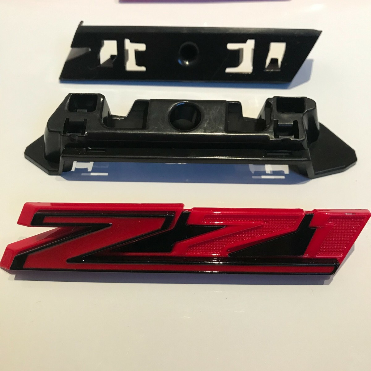 Genuine GM Z71 Grille Emblem For 2019-2021 Chevy Silverado 1500 - Chrome Red (Part #84384428)