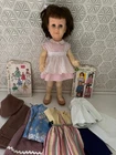 1960s Chatty Cathy Doll by Mattel with clothes & patterns. Sold as is.