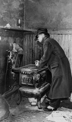 Fred Pasely using a coal stove for heat in a tenement house at Che .. Old Photo