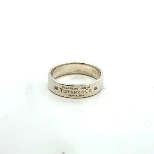 TIFFANY & CO. Vintage sterling silver and diamond return to tiffany band size 11