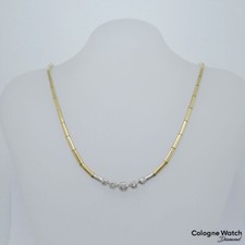 Collier im Verlauf mit ca. 0,26ct W-si Brillant in 750/18K Weiß-/Gelbgold