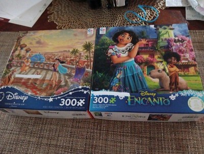2-Ceaco Disney 300 Lrg Pc Puzzles-JASMINE DANCING IN THE DESERT SUNSET & ENCANTO