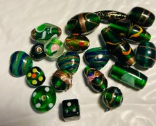 Green Glass beads with gold foil and floral embellishments