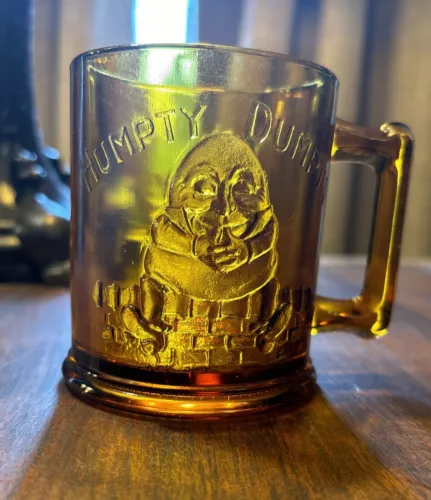 Vintage 1970's Tiara Amber Glass Child's Mug with Humpty Dumpy and Tom Thumb
